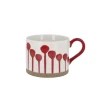 Tasse blanche à tâches rouges